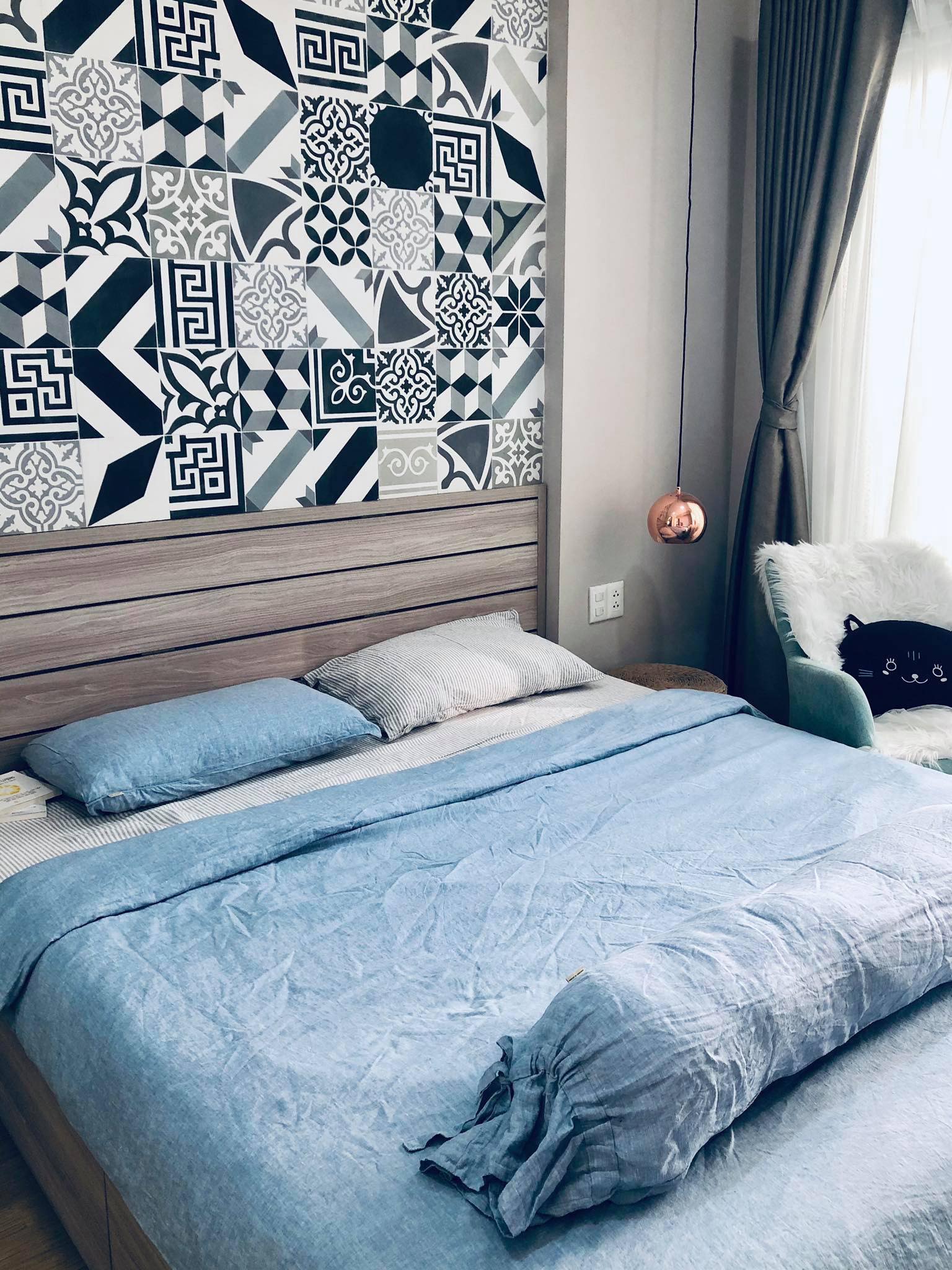 Eclectic bedroom with blue linen bedding and encaustic tile wall - SCANDALINEN
