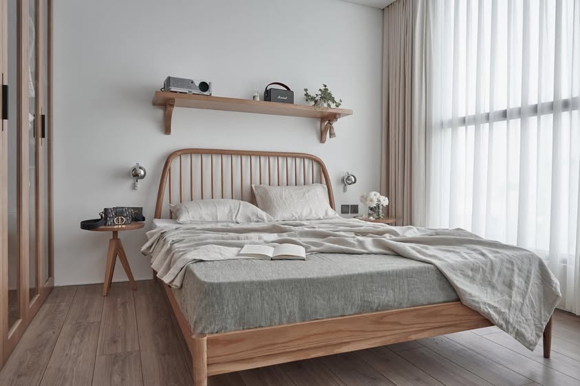 Flax SCANDALINEN French linen duvet cover and pillowcases on a spindle oak headboard bed in a Japandi bedroom with Marshall speaker and sheer curtains