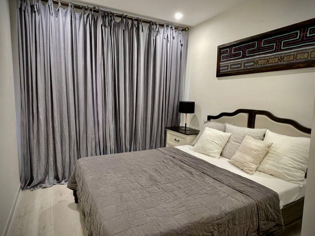 Dark Linen and Linen Curtains in an Indochine-Modern Bedroom