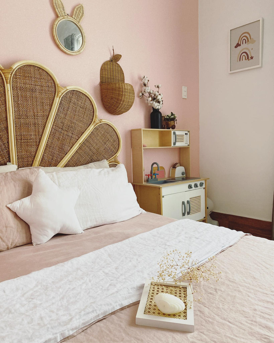 White Linen in a Boho Rattan Bedroom with Blush Walls
