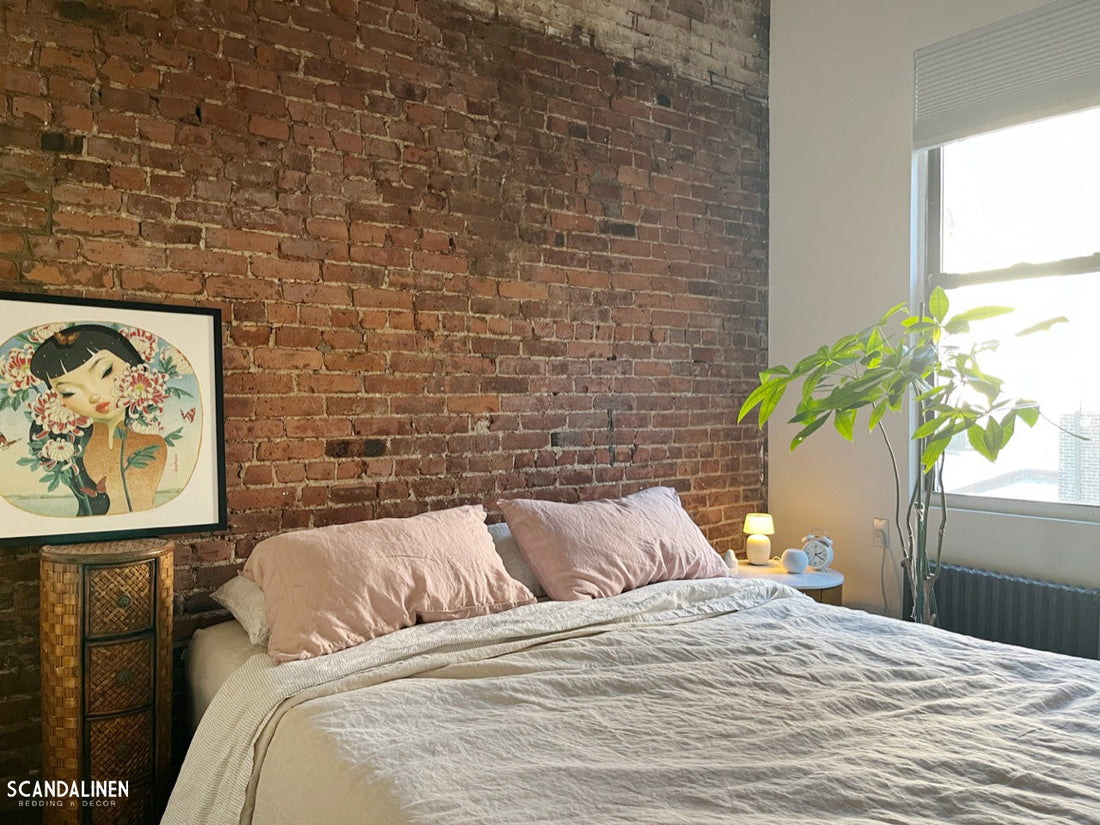 Flax French linen duvet cover with Dusty Pink pillowcases in a Manhattan apartment with exposed brick wall