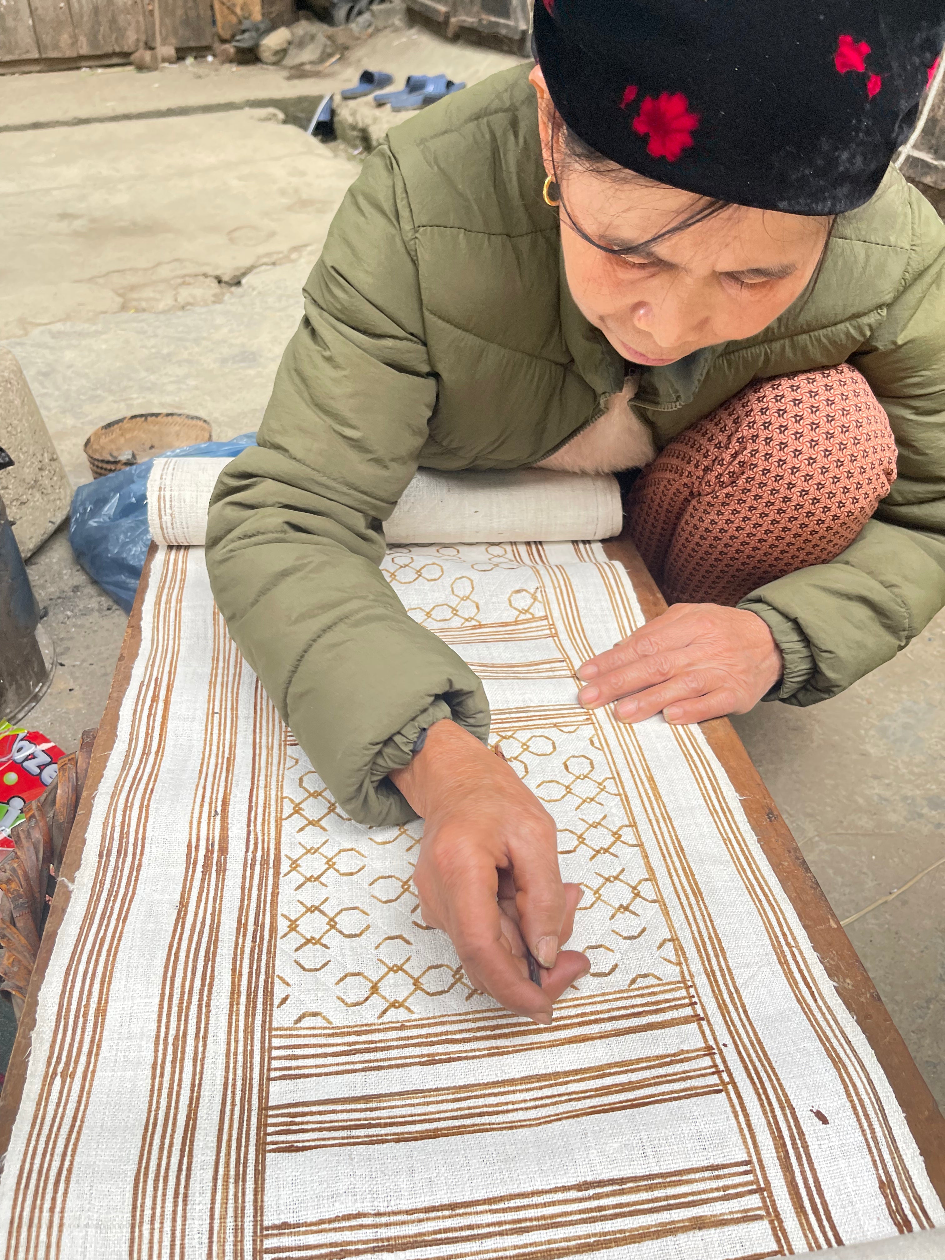 Vietnamese artisans handcrafting French linen bedding at SCANDALINEN workshop in Hanoi Vietnam
