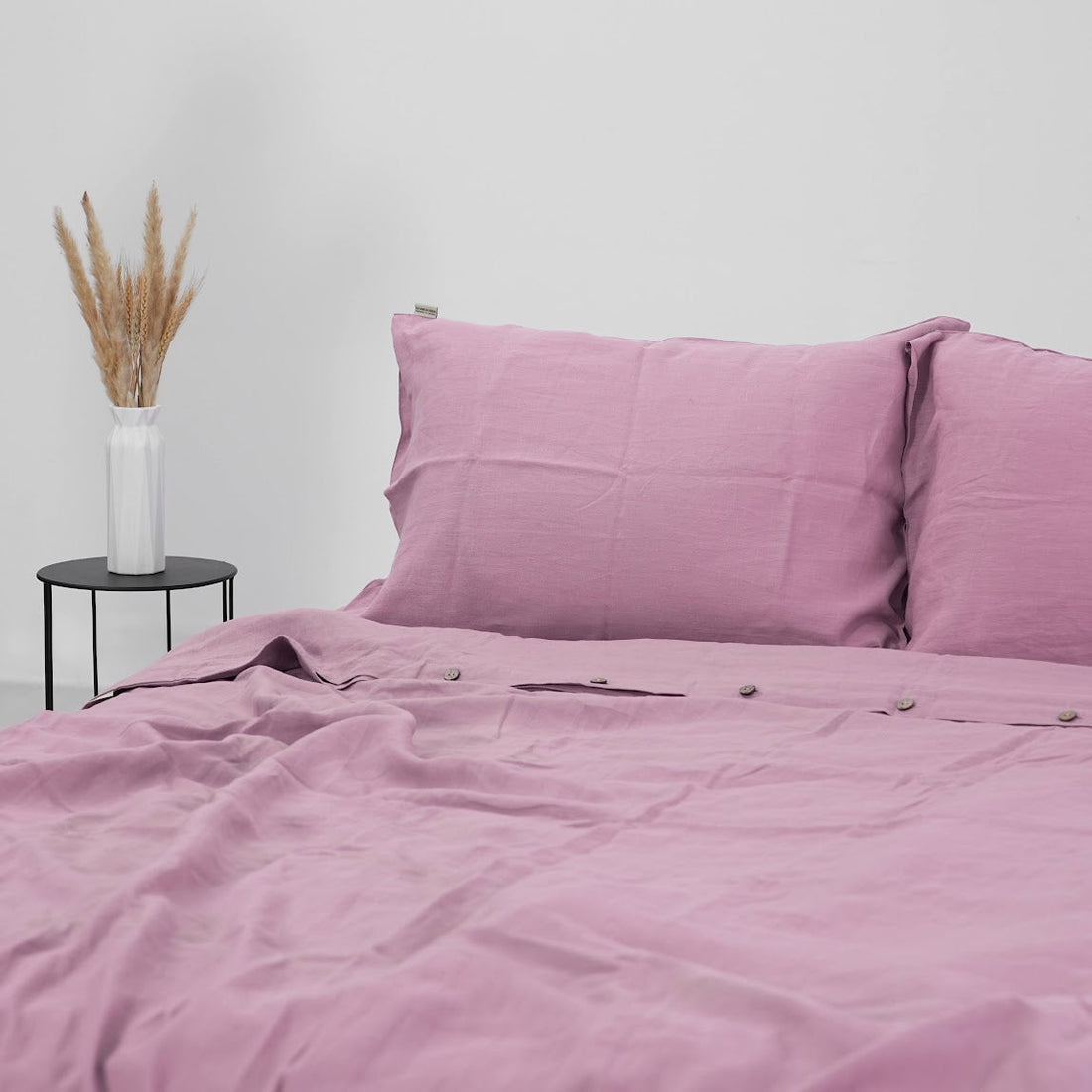 Blush pink French linen bedding on a bed, 100% European flax, stonewashed - SCANDALINEN