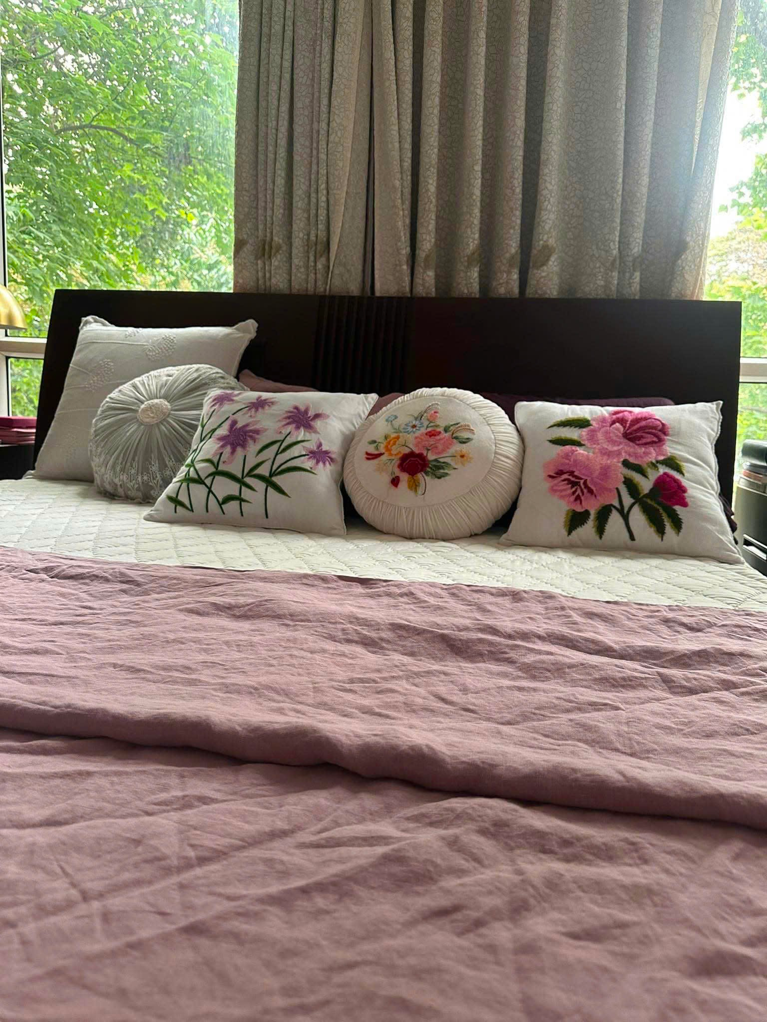 Bedroom styled with Purple French Linen Duvet Cover and embroidered floral cushions, natural light from window