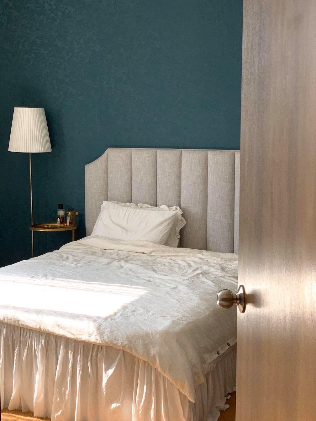 White French linen duvet cover and pillowcase styled on a bed with a teal accent wall — SCANDALINEN Real Homes