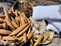 Natural kapok fibre and pods in a basket for handmade kapok pillow inserts - SCANDALINEN