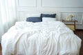 White bamboo linen fitted sheet on a bed, 70% bamboo 30% linen, breathable - SCANDALINEN