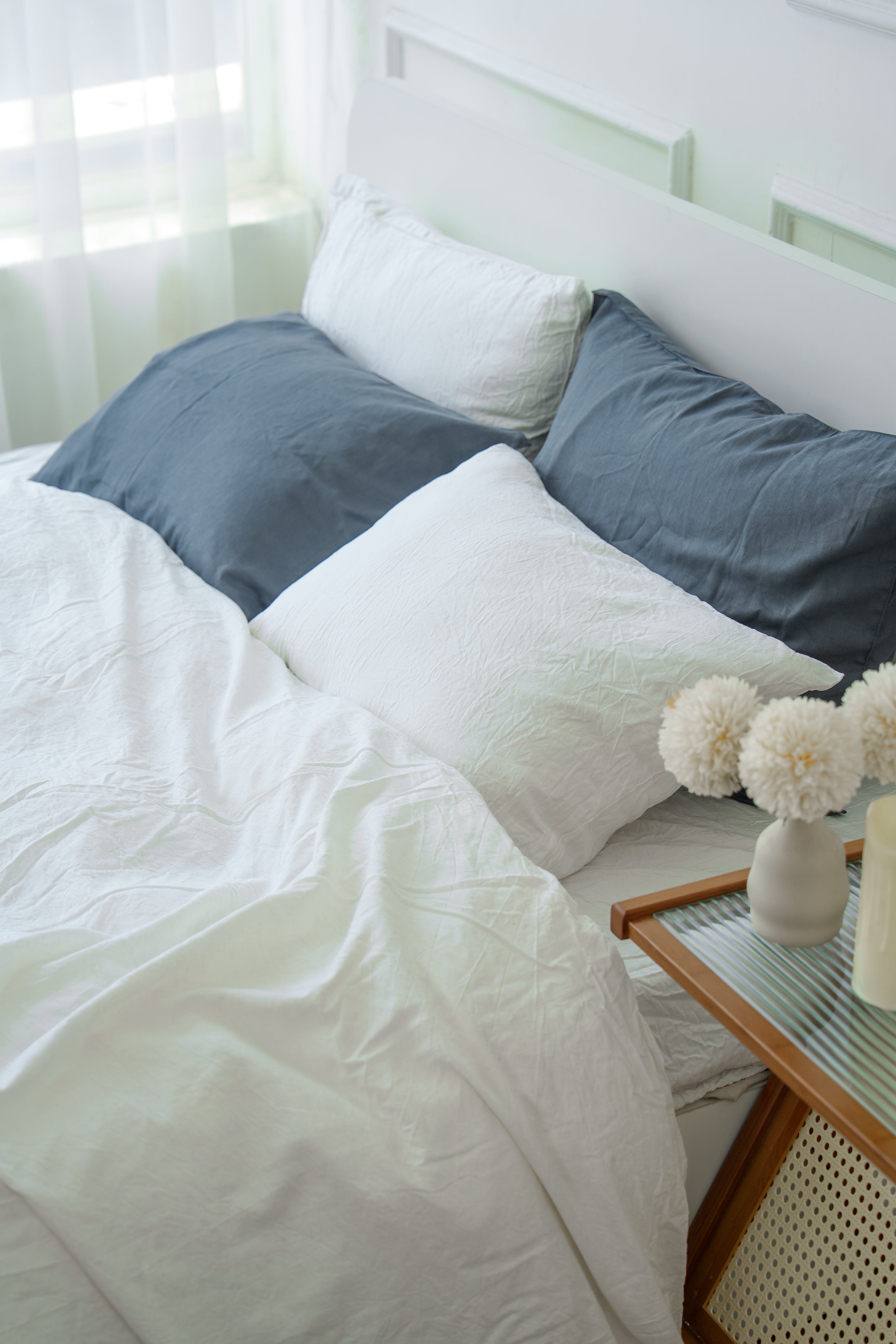 Grey bamboo linen pillowcase on a bed, 70% bamboo 30% linen, breathable - SCANDALINEN