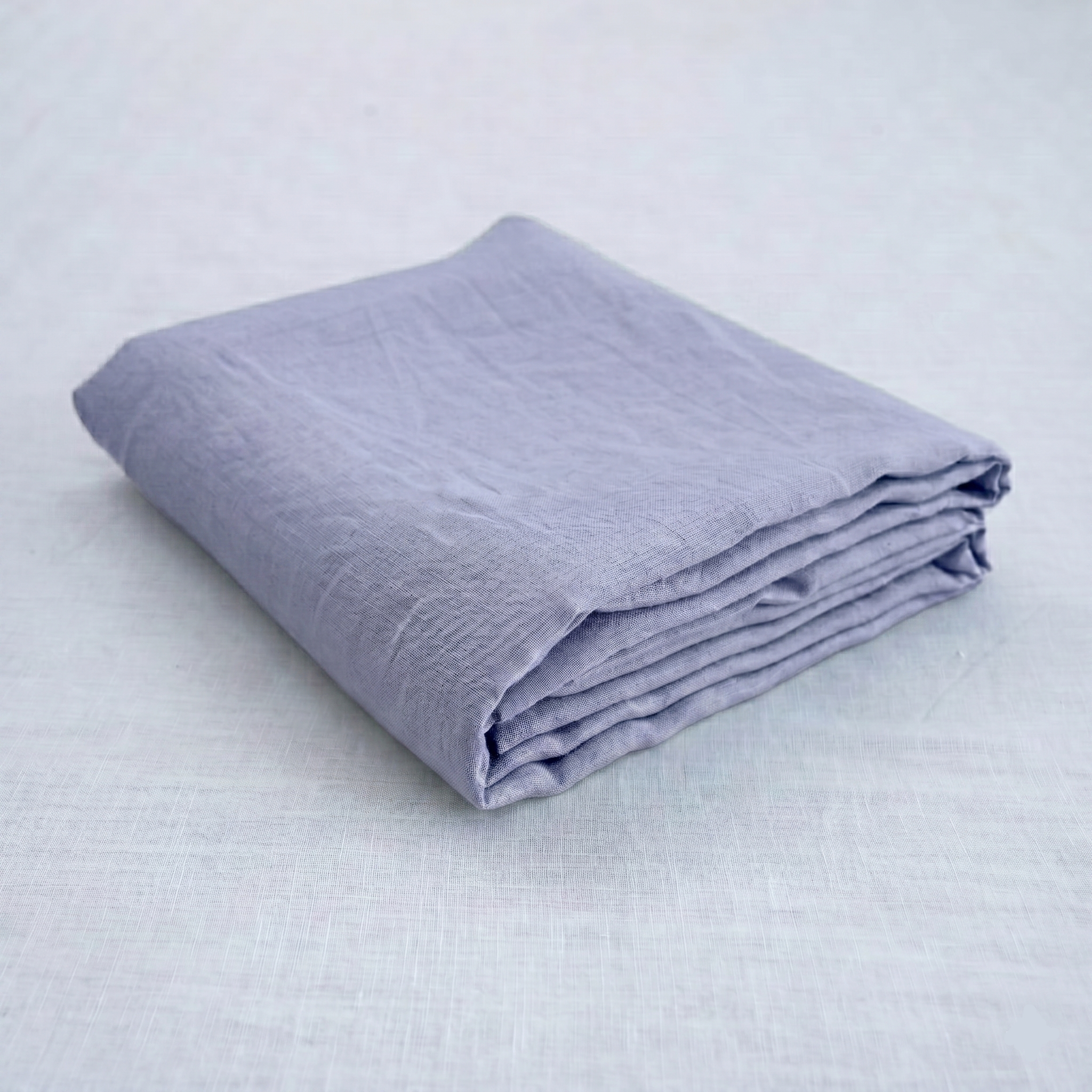 Steel French linen flat sheet on a bed, 100% European flax, stonewashed - SCANDALINEN