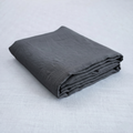Dark charcoal French linen flat sheet on a bed, 100% European flax, stonewashed - SCANDALINEN