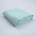 Mint French linen flat sheet on a bed, 100% European flax, stonewashed - SCANDALINEN