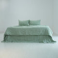 Green checkered French linen bedding set on a bed, 100% European flax - SCANDALINEN
