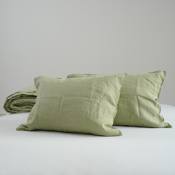 Avocado green French linen pillowcases on a bed, 100% European flax, stonewashed - SCANDALINEN