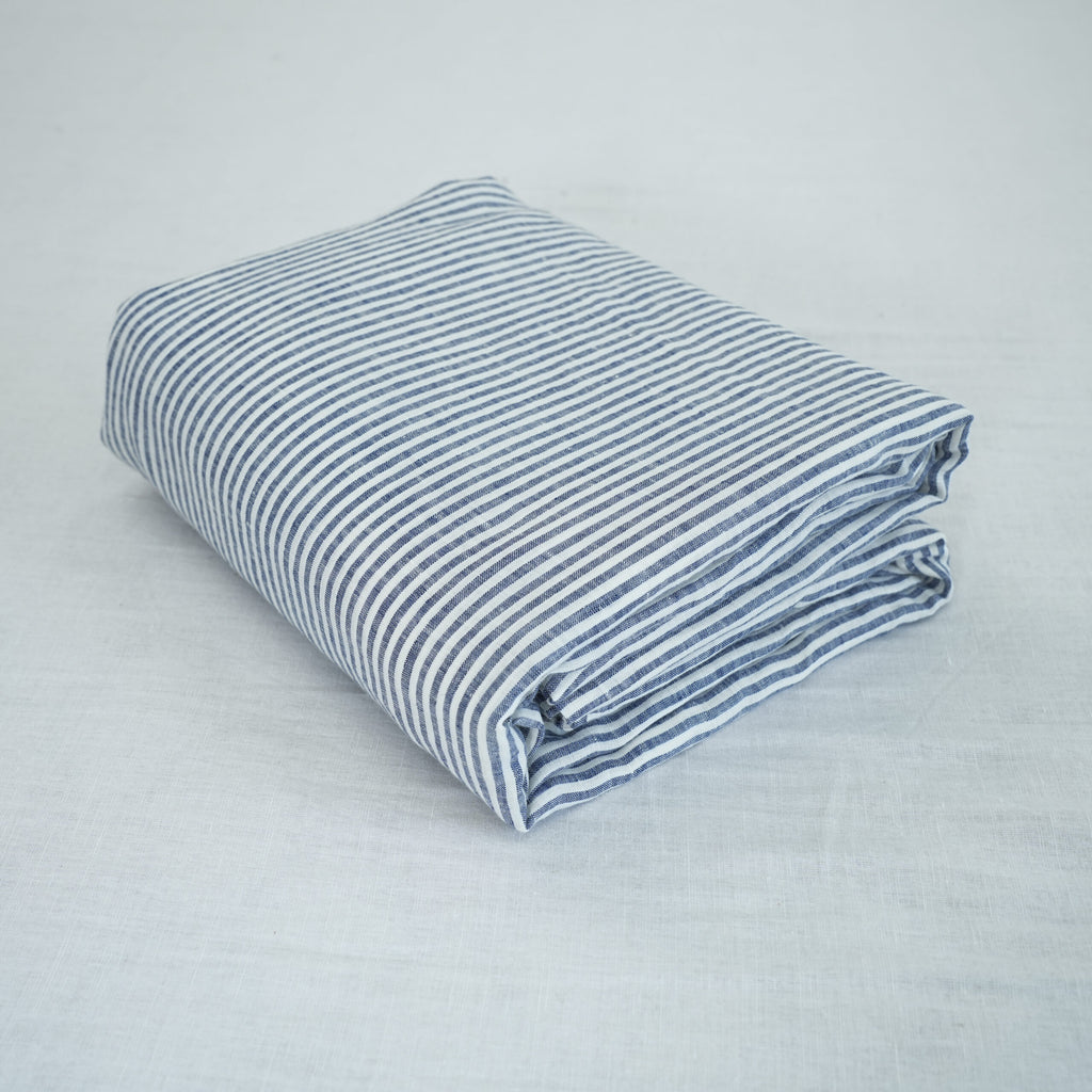 Navy Striped French linen top sheet on a bed, 100% European flax, stonewashed - SCANDALINEN
