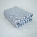 Navy Striped French linen top sheet on a bed, 100% European flax, stonewashed - SCANDALINEN