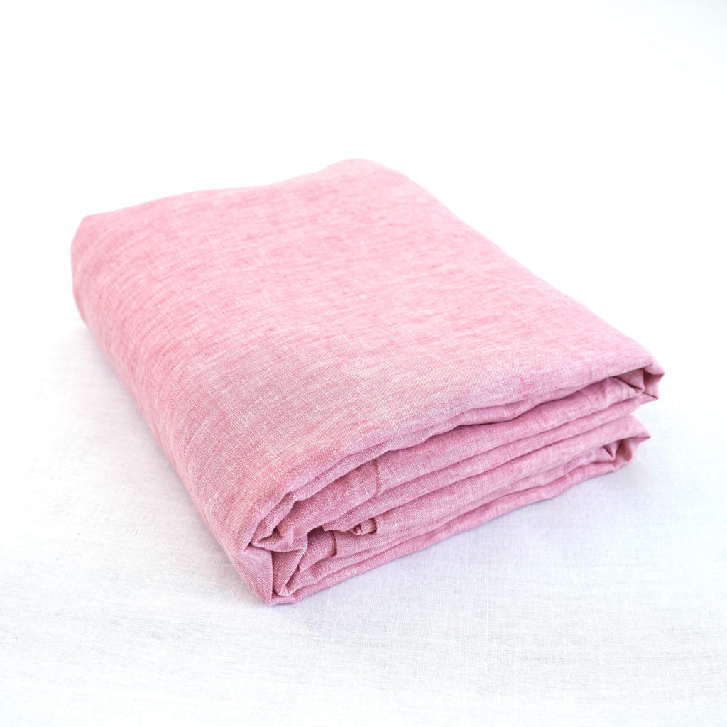 Red Pink French linen top sheet on a bed, 100% European flax, stonewashed - SCANDALINEN