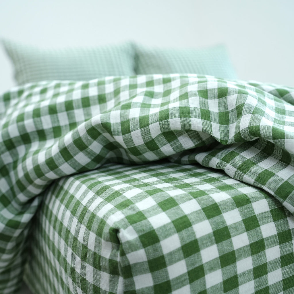 Green grid gingham French linen flat sheet on a bed, 100% European flax, stonewashed - SCANDALINEN