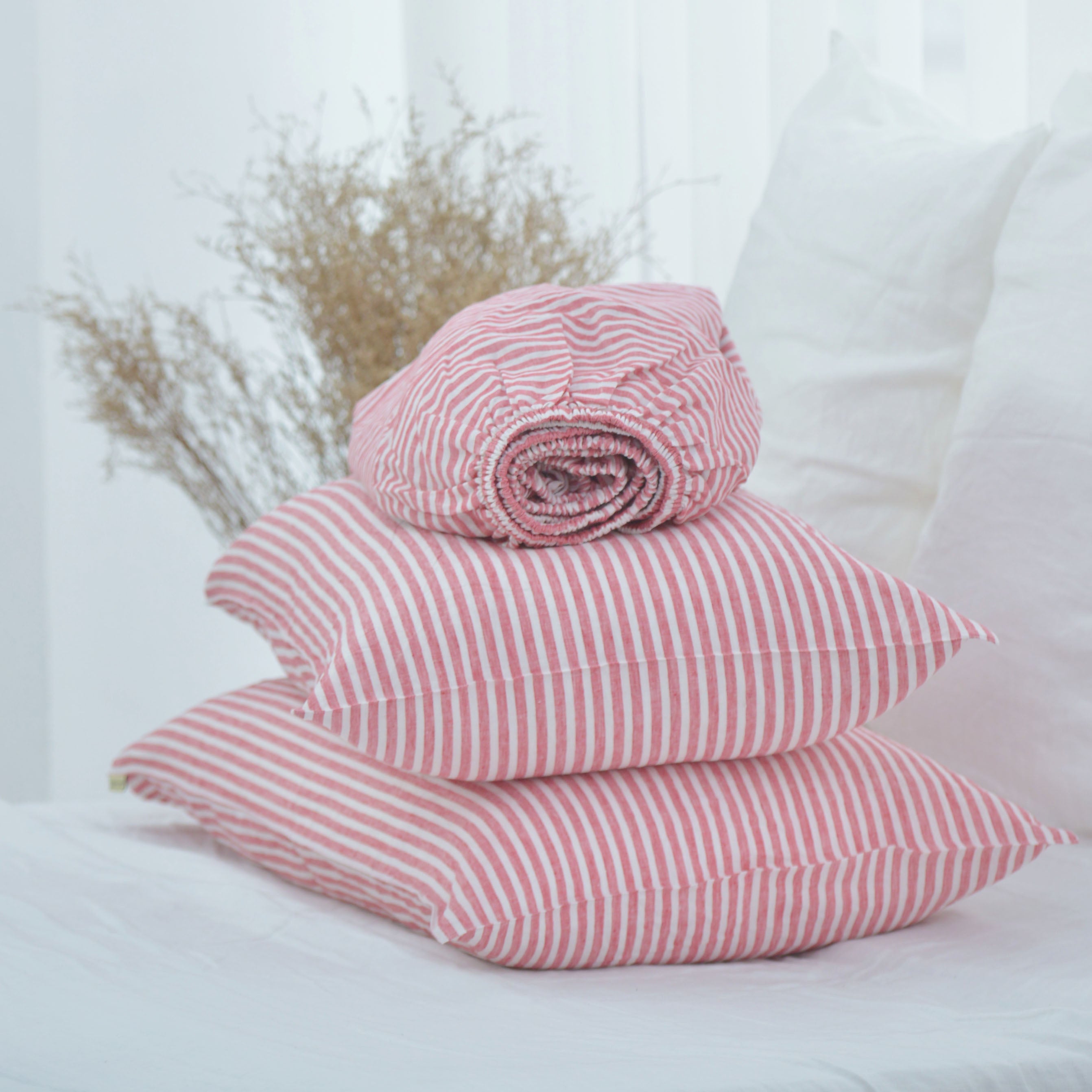 Red striped French linen sheet set on a bed, 100% European flax, stonewashed - SCANDALINEN